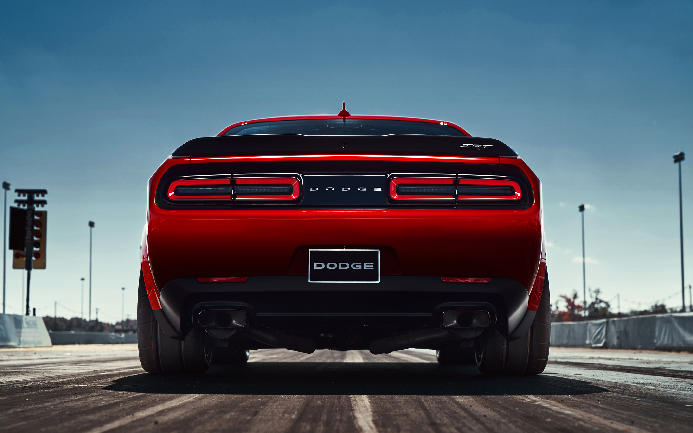 Download Red Dodge Challenger Demon 4K On A Street Wallpaper  Wallpapers com