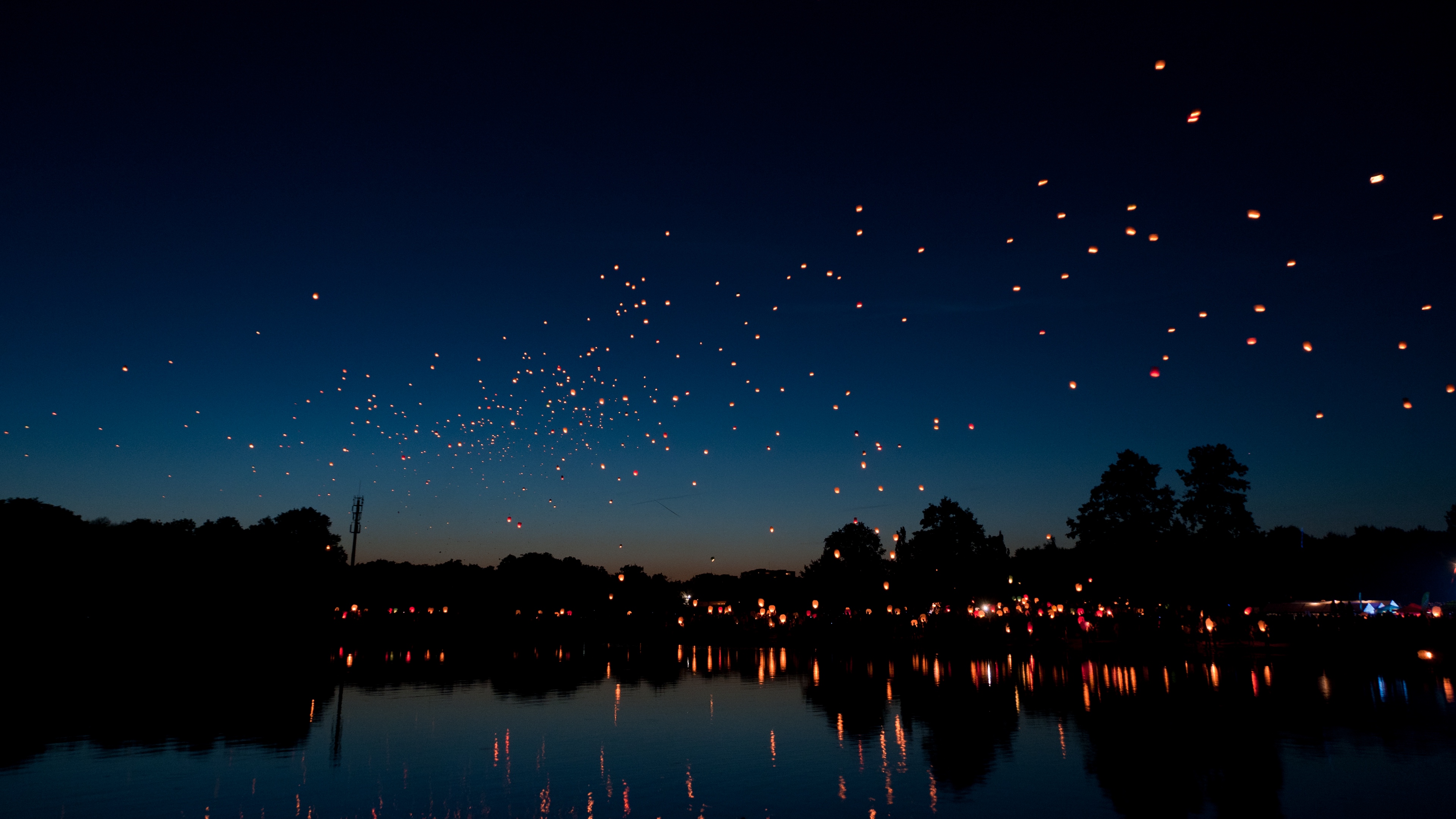 chinese lanterns  sky lanterns  night  river holiday 4k 