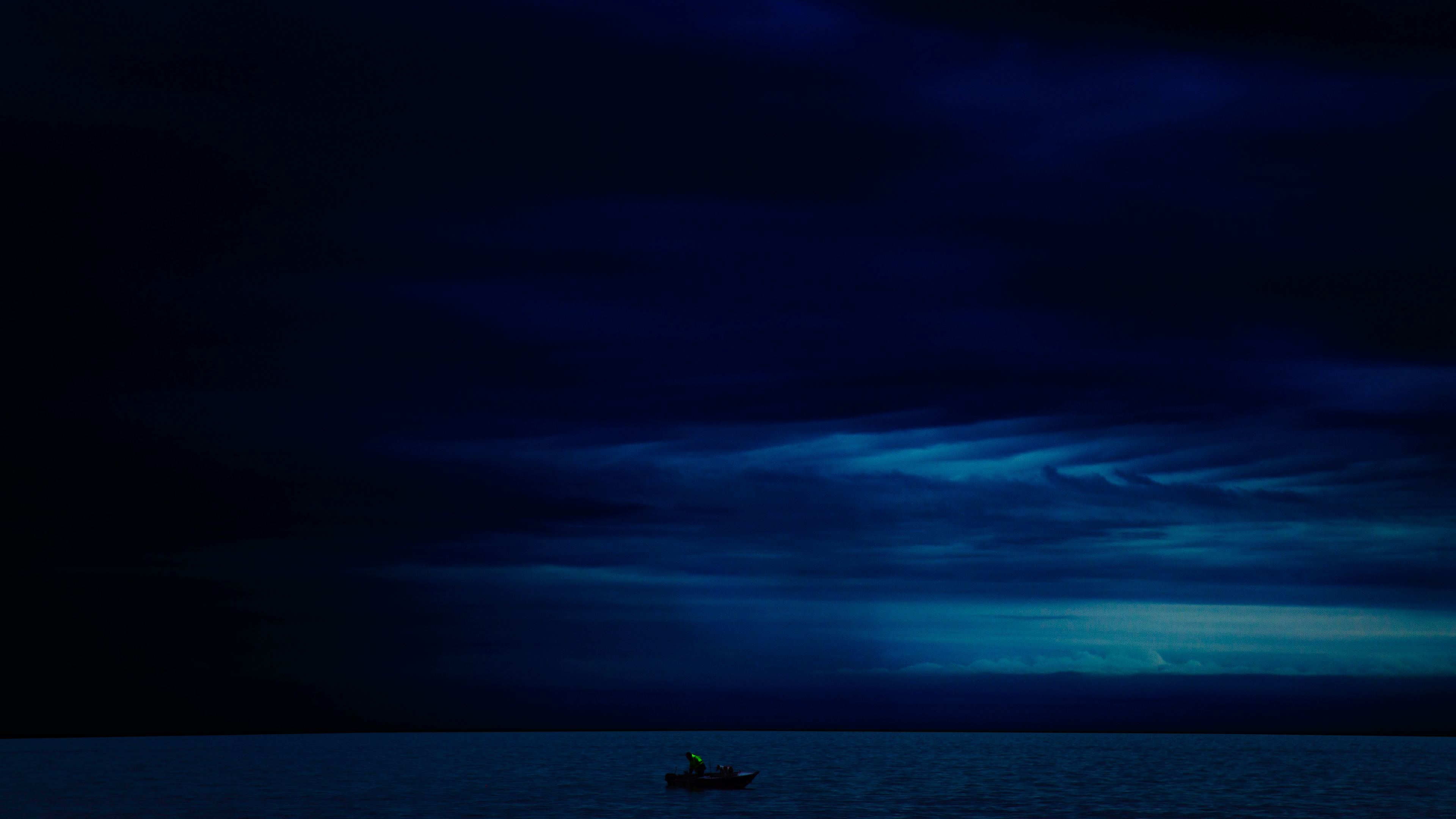Wallpaper 4k Dark Evening Blue Cloudy Alone Boat In Ocean 4k Wallpaper