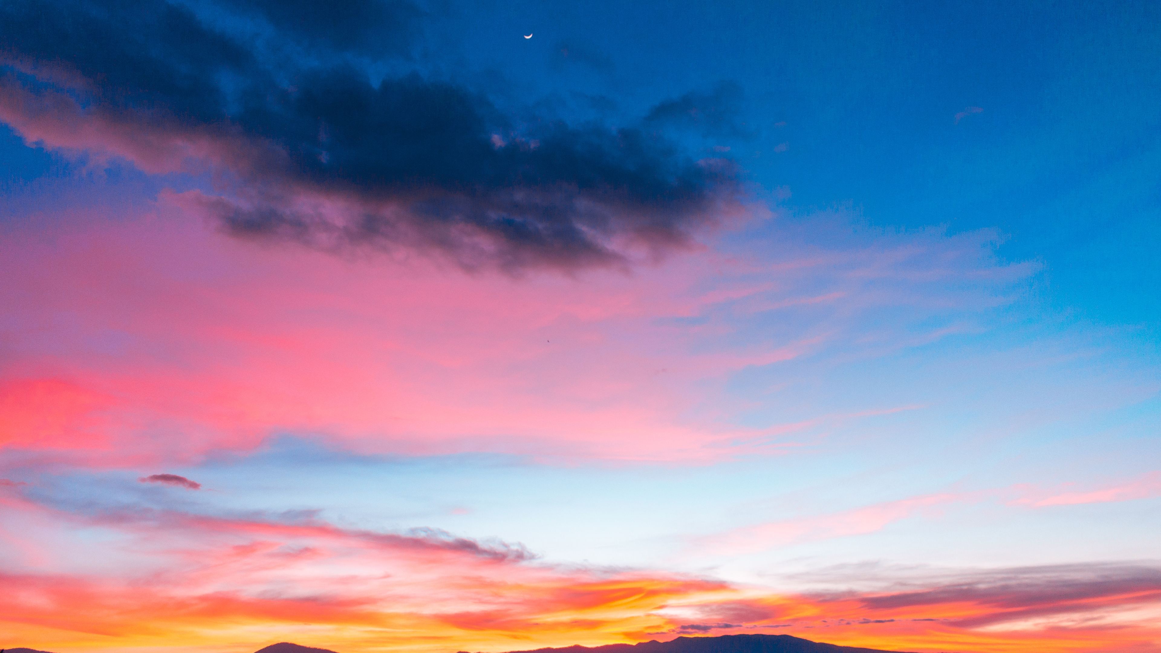 Colorful Sunset Sky: Bức ảnh thú vị này sẽ đưa bạn đến với khung cảnh hoàng hôn thần tiên, khi mặt trời lặn và tất cả mọi thứ trở nên màu sắc. Màu cam, hồng, tím nhiệt đới và xanh biển quyến rũ, bạn sẽ cảm thấy như đang được đắm mình trong một thế giới màu sắc.