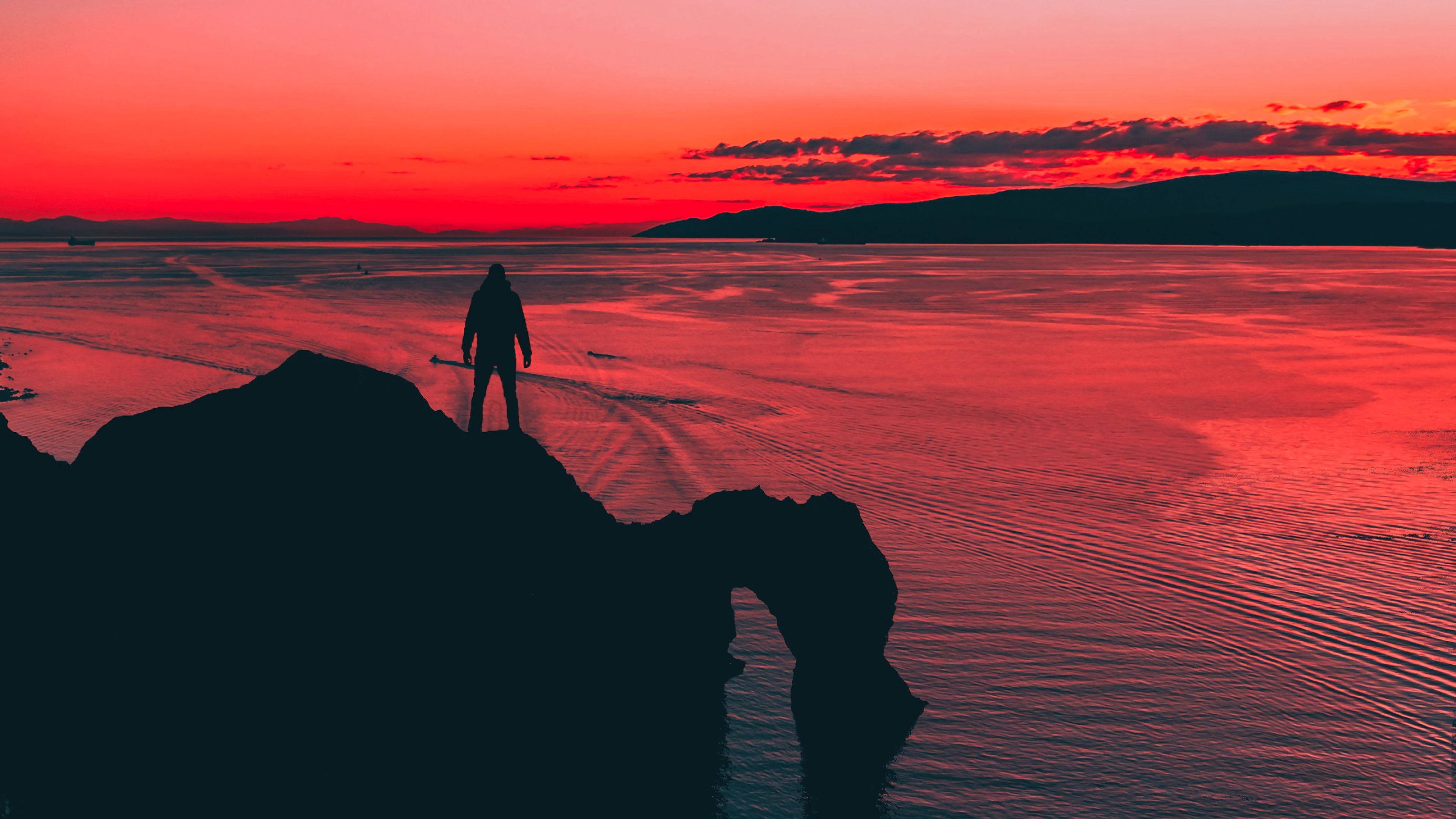 Men Standing At Cliff Sunset