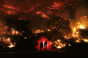 two man standing in front of forest fire 1574938702 300x200 - Two Man Standing In Front Of Forest Fire -