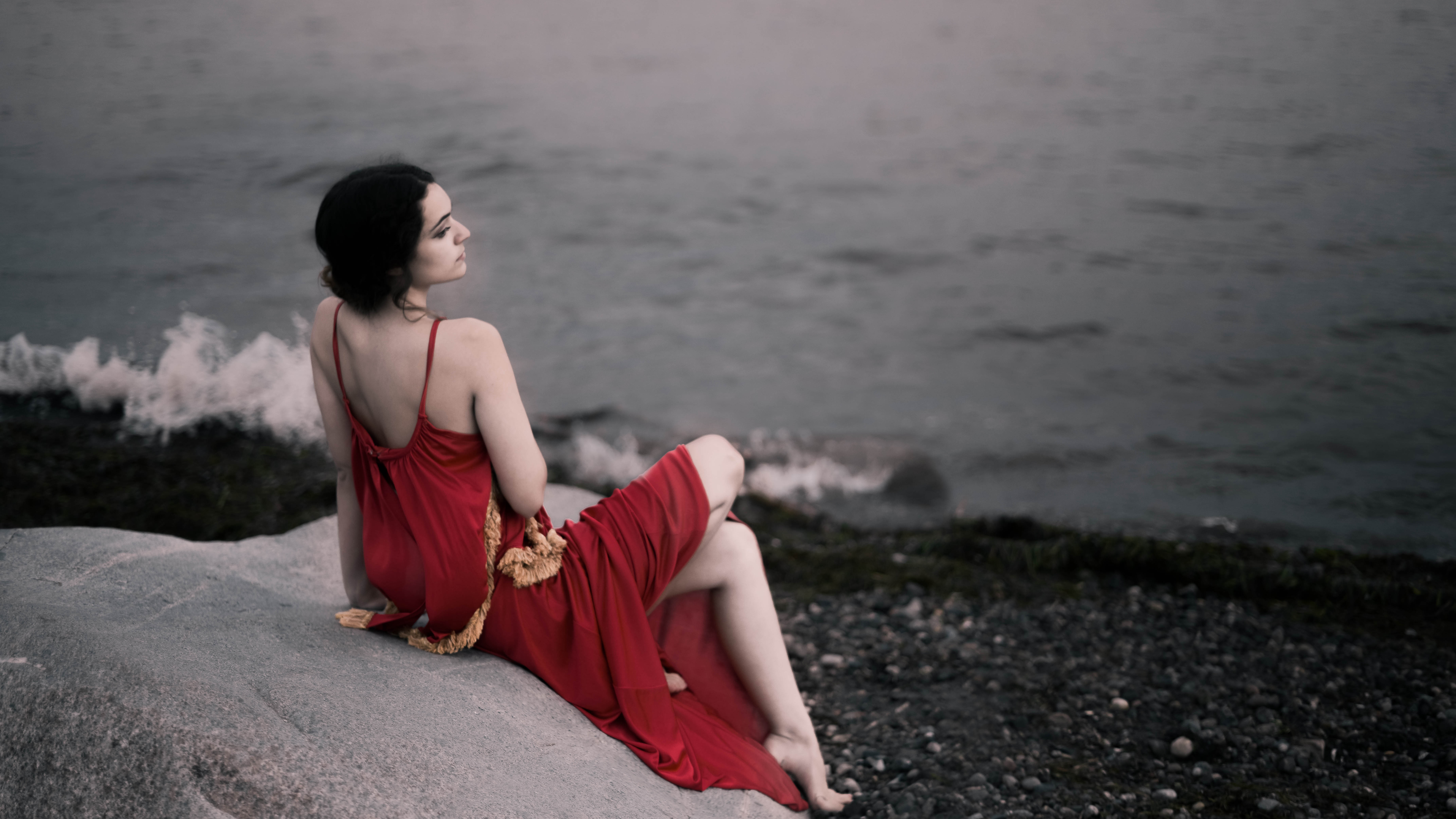 girl in red dress sitting on rocks beach 1575665092 - Girl In Red Dress Sitting On Rocks Beach -