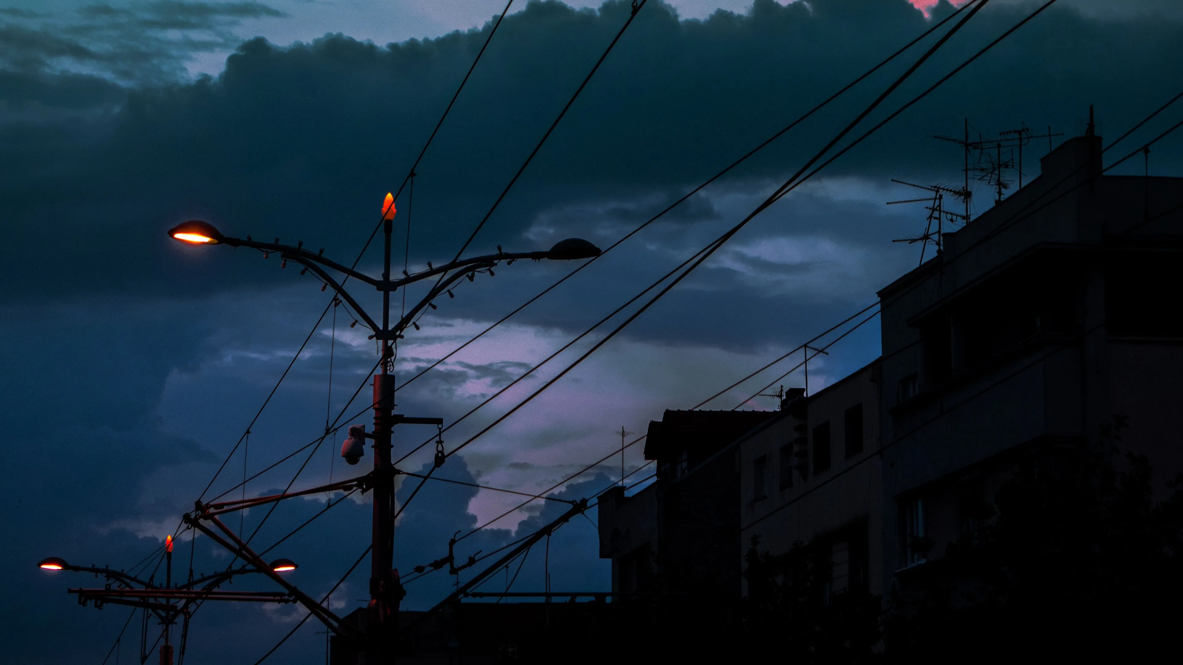 cable poles lights city twilight dark 4k 1691849539