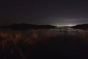 lake night starry sky grass darkness 4k 1692006755