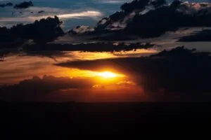sunset clouds sun twilight dark 4k 1692006750