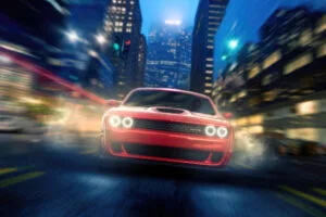 red dodge challenger roaming the city streets 4k 1698228641