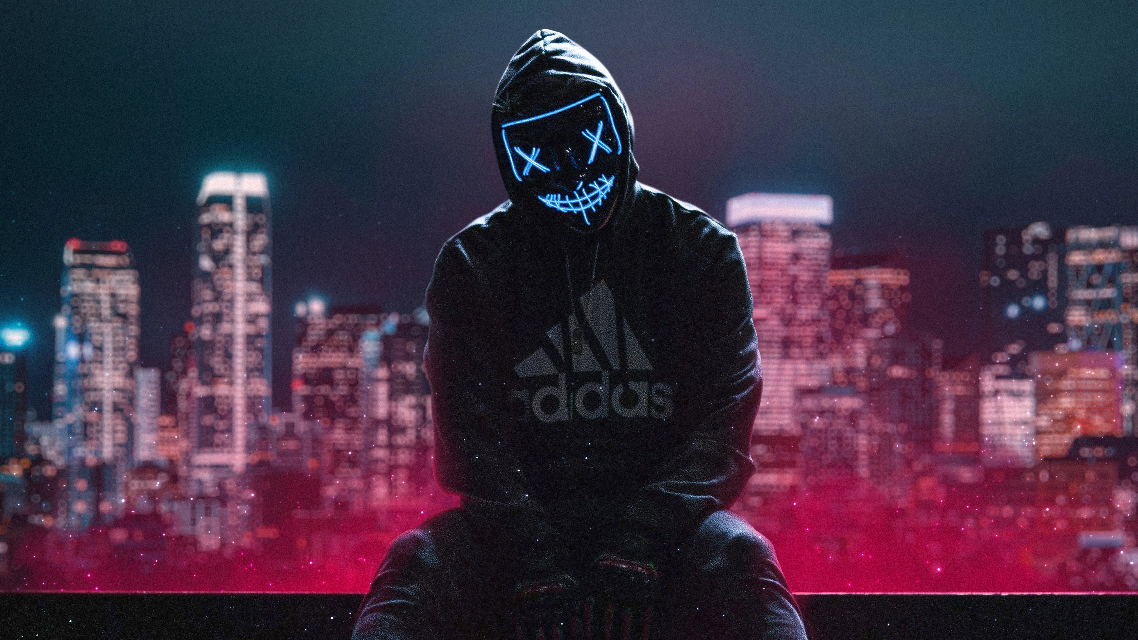 hoodie boy sitting neon mask ub.jpg
